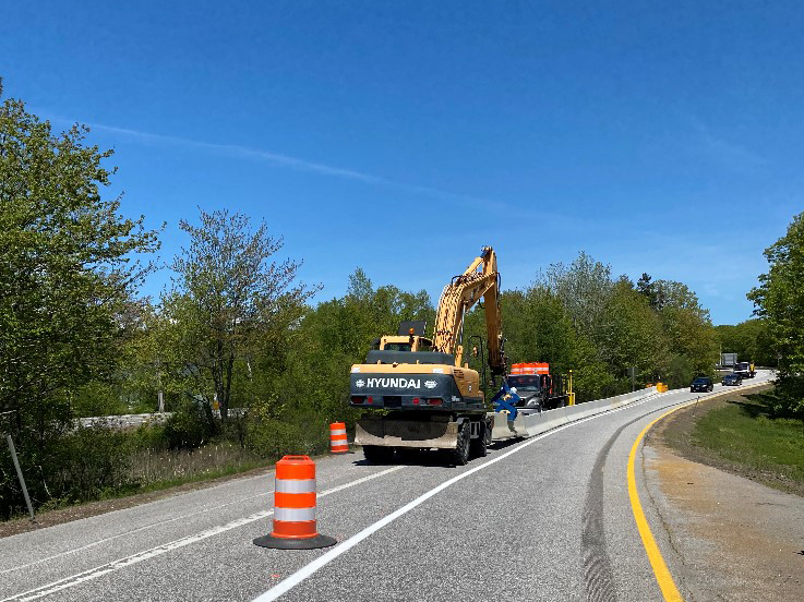 Machines placing barricades on the road